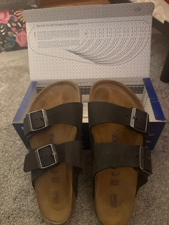 Birkenstock Two-Strap Sandals in Black with Brown Footbed - Picture 1 of 3